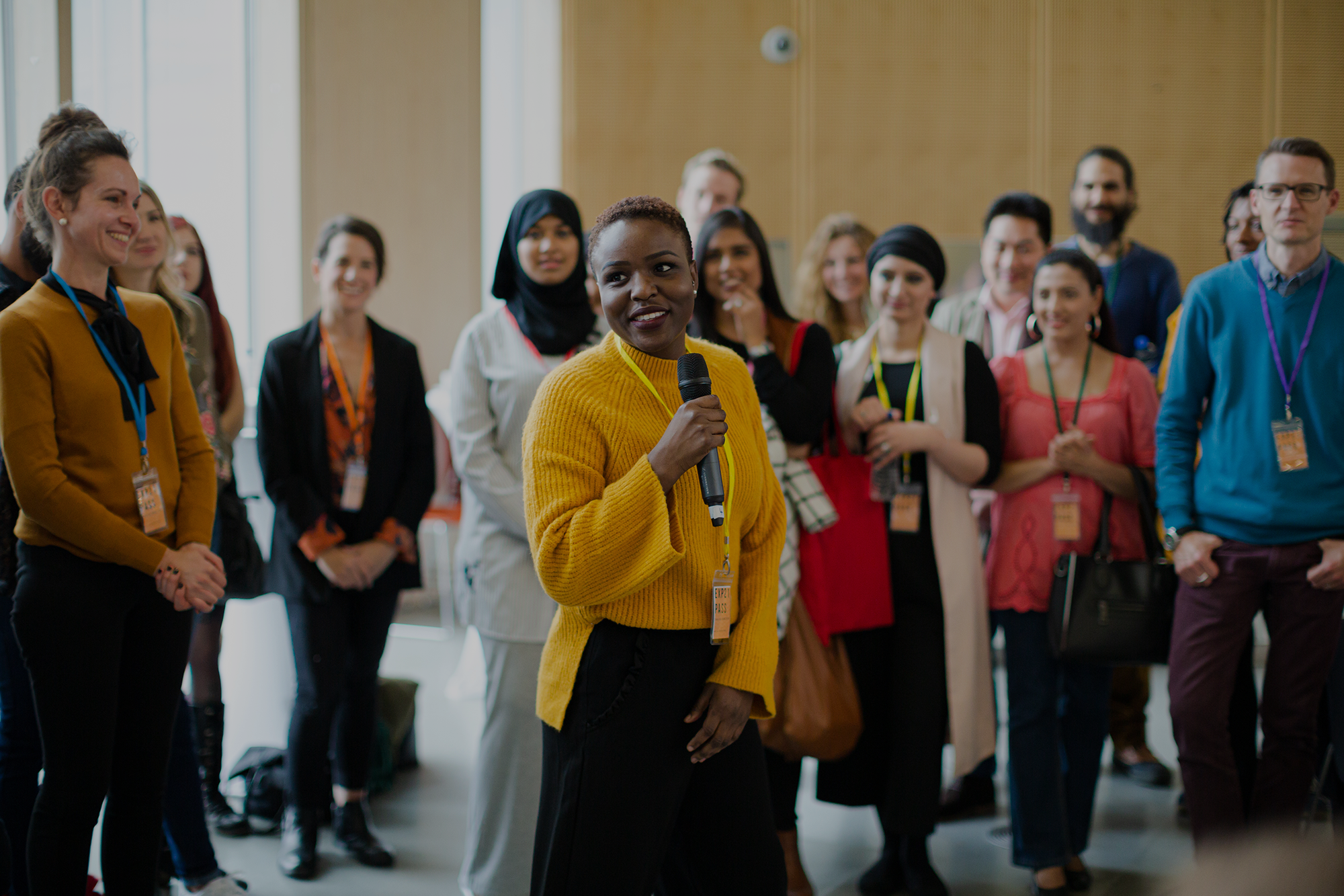 African American woman speaking to the crowd at an event.